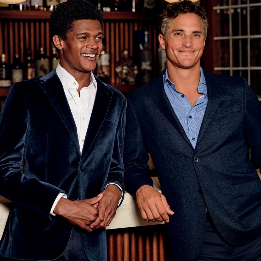 Two male models wearing suits